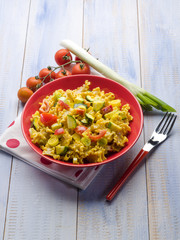 pasta with saffron cream sauce and sliced vegetables