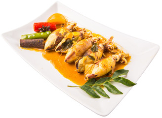 Delicious fried squid with curry gravy on white plate