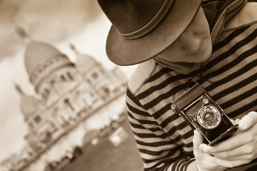 France, Paris, young man taking photograph, Sacre Coeur in backg