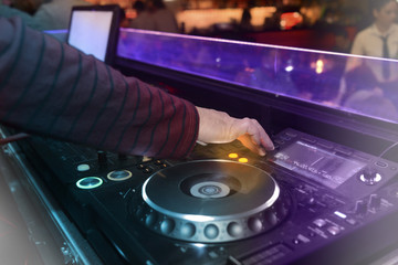 DJ playing music in the nightclub