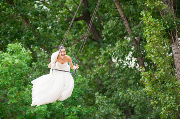 Smiling Bride on swing