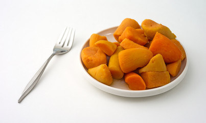 Canned yams on plate with fork
