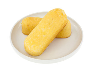 Two bite size filled cakes on a plate