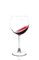 red wine swirling in a goblet wine glass,