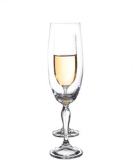 Full and empty champagne glasses with white wine
