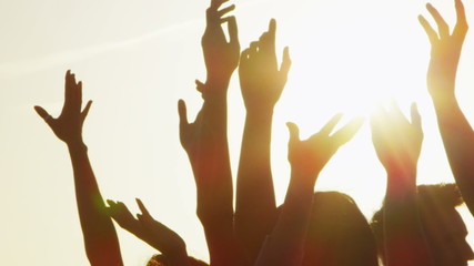 Happy carefree group of friends dancing on the beach at sunset - Powered by Adobe