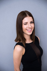 Obraz premium Portrait of attractive cute woman winking 