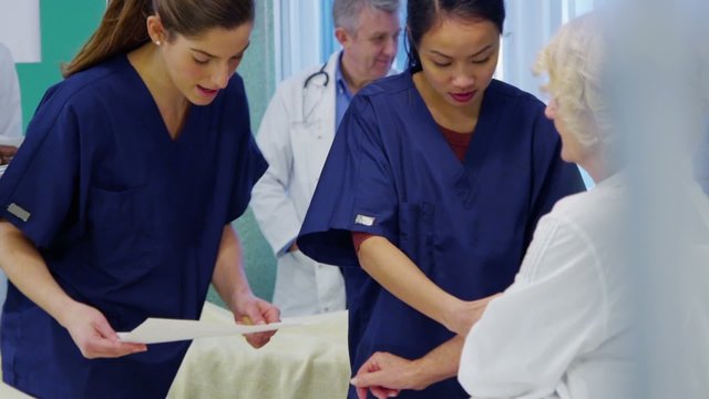 Medical staff working together and taking care of patients on a hospital ward