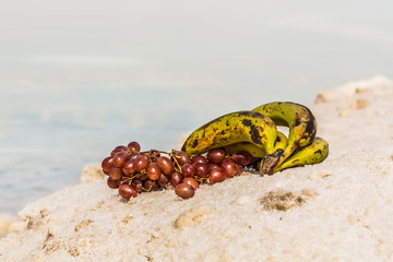 Fototapeta na wymiar bananas and grapes on the banks