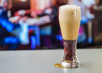 full glass of dark beer