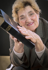 Senior woman reading holly bible