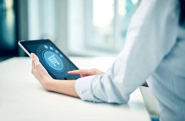 close up of woman hands with tablet pc at office