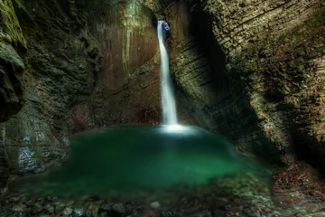Fototapeten Beautiful waterfall on Kozjak creek in cave in Slovenian Alps in © Samo Trebizan