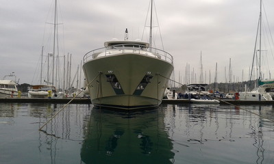 powerful motor boat super yacht in marina port 