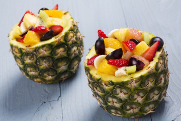 Fresh fruit salad served in bowls with fresh pineapple