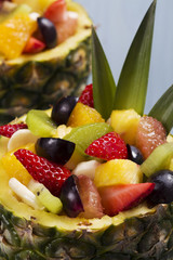 Fresh fruit salad served in bowls with fresh pineapple