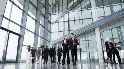 Diverse group of business people in a light and modern office building