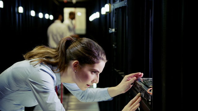 Team of IT engineers working in a data centre