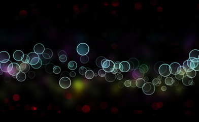 Abstract christmas bokeh lights as background on black