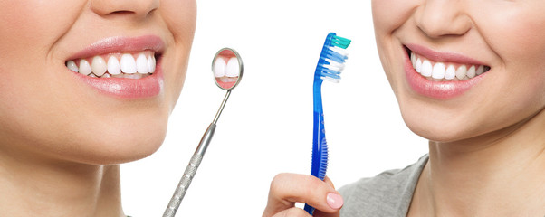 Oral hygiene. Teeth treatment. Young girl with brush and mirror
