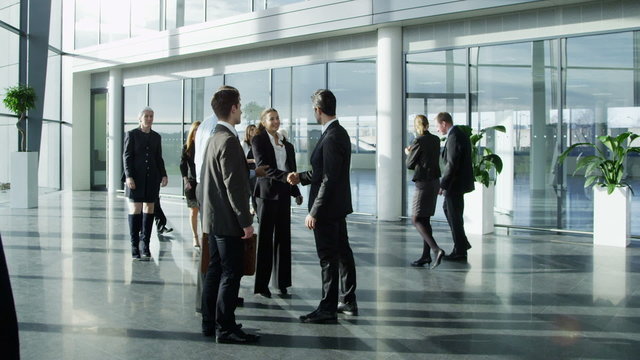 Diverse group of business people in a light and modern office building