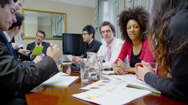 Time lapse of a diverse team of professionals in a boardroom meeting