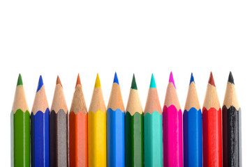 Front view of aligned coloring crayons isolated in white