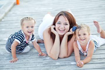 Mother with her daughters by the sea