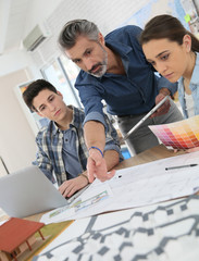 Teacher with students in architecture school