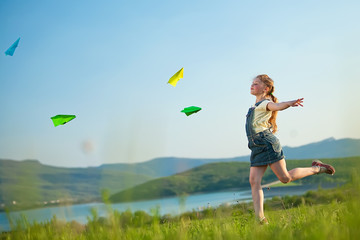 Kid in a green field