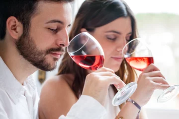 Fotobehang Couple at wine tasting. © karelnoppe