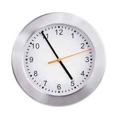 Office round clock shows almost five hours