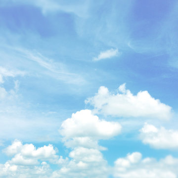 Fluffy soft white clouds in blue sky