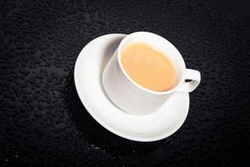 cup coffee on the black background