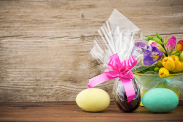 Easter eggs on wooden background with copy space