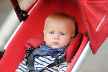 Little baby boy in stroller