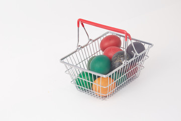 colorful painted Easter eggs in the basket for shopping