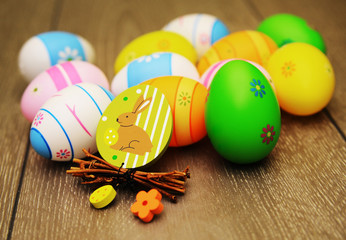 Fototapeta na wymiar Easter eggs and decoration on wooden background