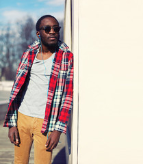 Outdoor fashion portrait of stylish young african man