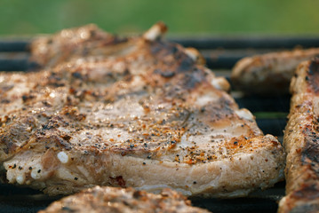 marinated juicy pork ribs on grill