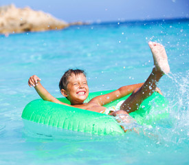 Boy playing in the sea