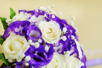 Image of wedding rings on flowers