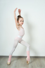 A little adorable young ballerina posing and stretching © jutaphoto