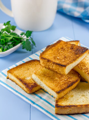 Breakfast toasts with verdure and a cup of coffee