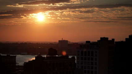 Time lapse cloudscape with the sun setting over the horizon