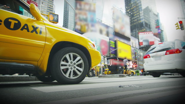 Yellow taxi waiting in traffic in New York City