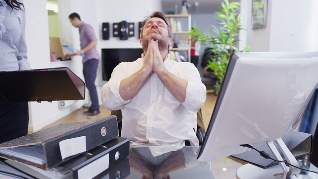Time lapse of business people in a light and modern open plan office space