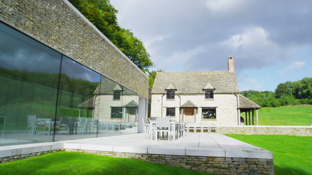 Exterior view of a traditional English cottage with contemporary built extension
