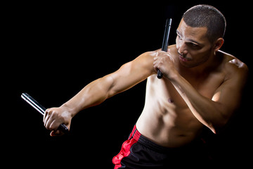 man demonstrating Filipino stick fighting martial arts