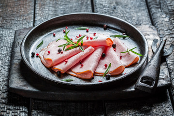 Fresh cold meats with herbs and pepper